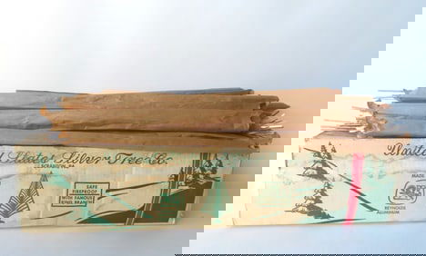 A "United States Silver Tree Co." artificial silver Christmas tree in original box, 6 1/2 feet tall