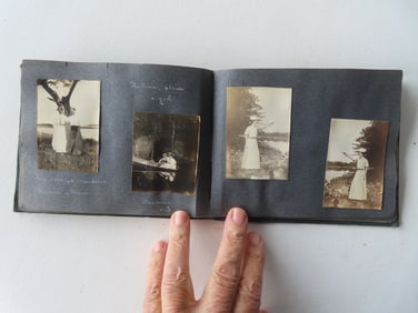 An original family photo album (small images) with many rustic scenes near cabins, lakes and rivers