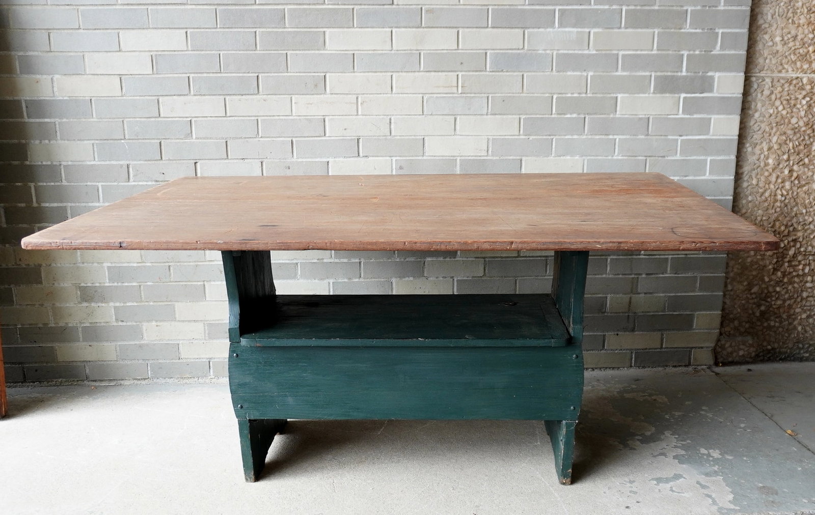 A late 19th century hutch table having a scrubbed pine or poplar wood top over base in green paint.: A late 19th century hutch table having a scrubbed pine or poplar wood top over base in old but not original green paint, and having a lift top seat. Note the table with good overhang so can sit 6 comf