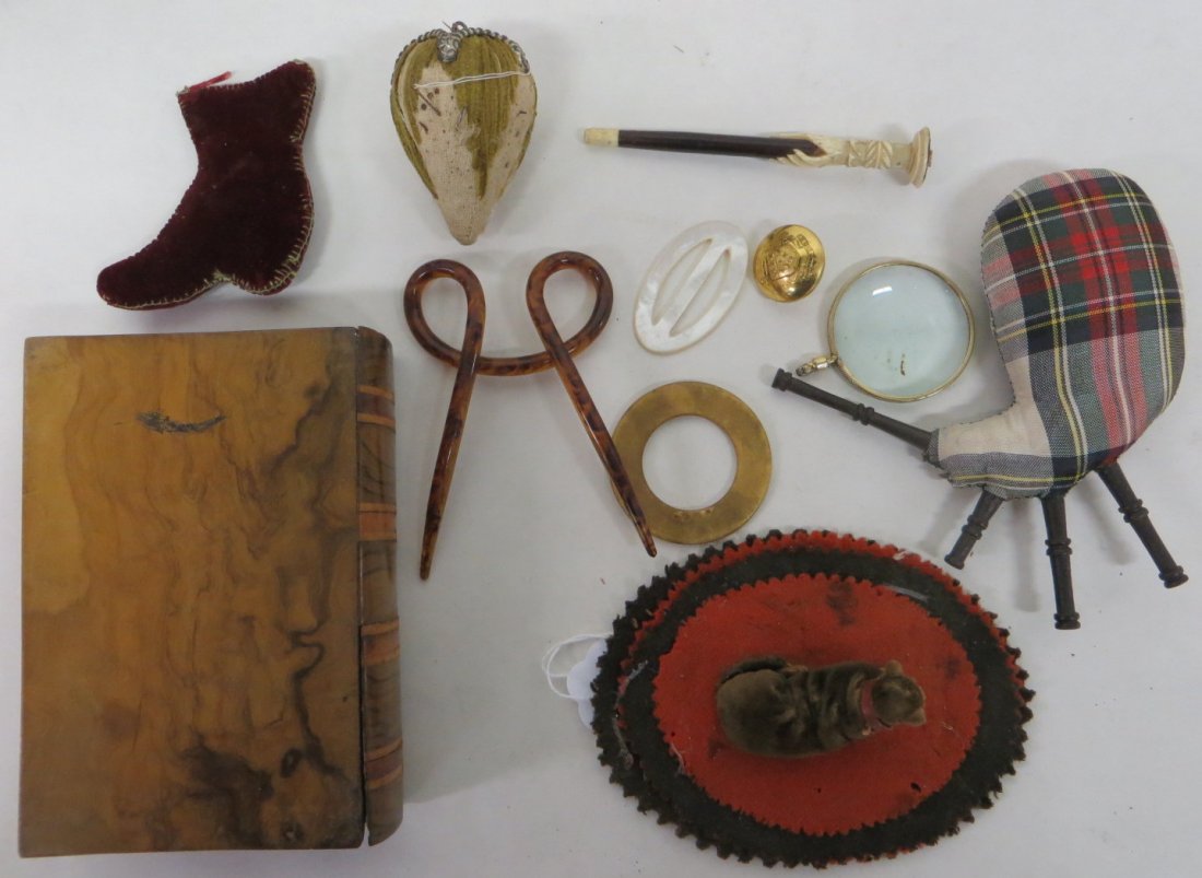 Lot of 11 mostly miniature ladies collectibles includin: Lot of 11 mostly miniature ladies collectibles including 2 hand made pin cushions (one in the form of a resting dog with shoe button eyes), graphite pen handle in carved bone or ivory, small book-shap