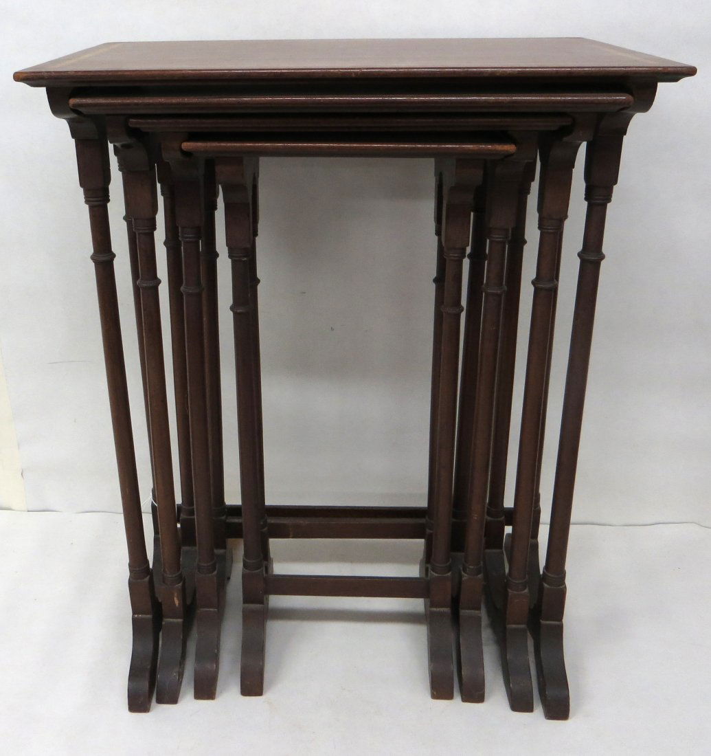Set of 4 mahogany nesting tables with line inlay and co: Set of 4 mahogany nesting tables with line inlay and column shaped legs. Early to mid 20th century.