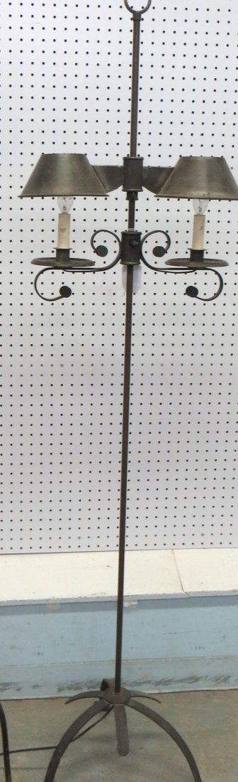 Hand made iron floor lamp with adjustable double font w: Hand made iron floor lamp with adjustable double font with tin shades. Circa 1950.