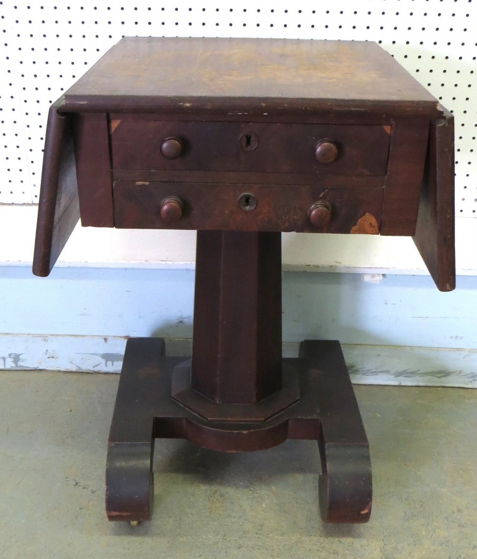 Two drawer drop-leaf Empire pedestal base mahogany sewi: Two drawer drop-leaf Empire pedestal base mahogany sewing stand - veneer losses. Provenance: From a large Beekman NY estate, name withheld by family.