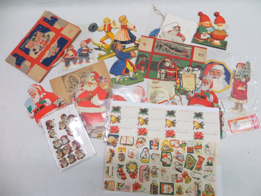 Lot of 70+ Vintage Santa / Christmas die cuts, tags, an: Lot of 70+ Vintage Santa / Christmas die cuts, tags, and seals. Candy boxes, Bank Savings Club Santa ornament, accordion type paper dolls. Condition Good to Excellent.