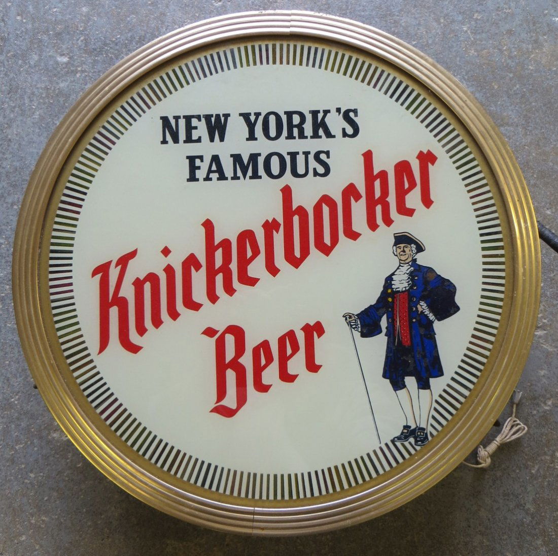 Round Knickerbocker Beer advertising bar light - light : Round Knickerbocker Beer advertising bar light - light revolves around perimeter of clock - signed on reverse "Illuminated-Color-In-Motion" - manufactured by the Ohio Advertising Display Co. - Model 6