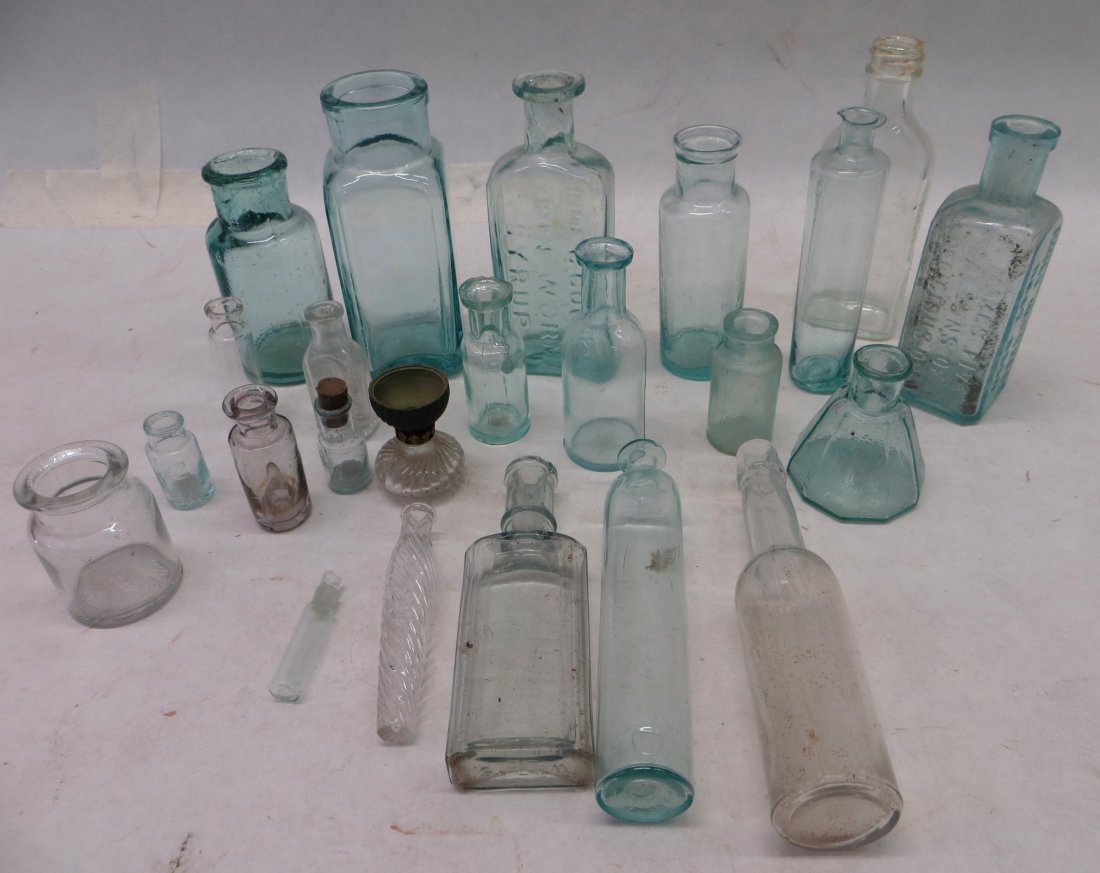 Lot of small bottles including Pin Worm syrup plus othe: Lot of small bottles including Pin Worm syrup plus other drug store related, 5 hand blown bottles with pontil marks, 2 perfume bottles, etc. Most 19th century or earlier. Provenance: From the Bower es