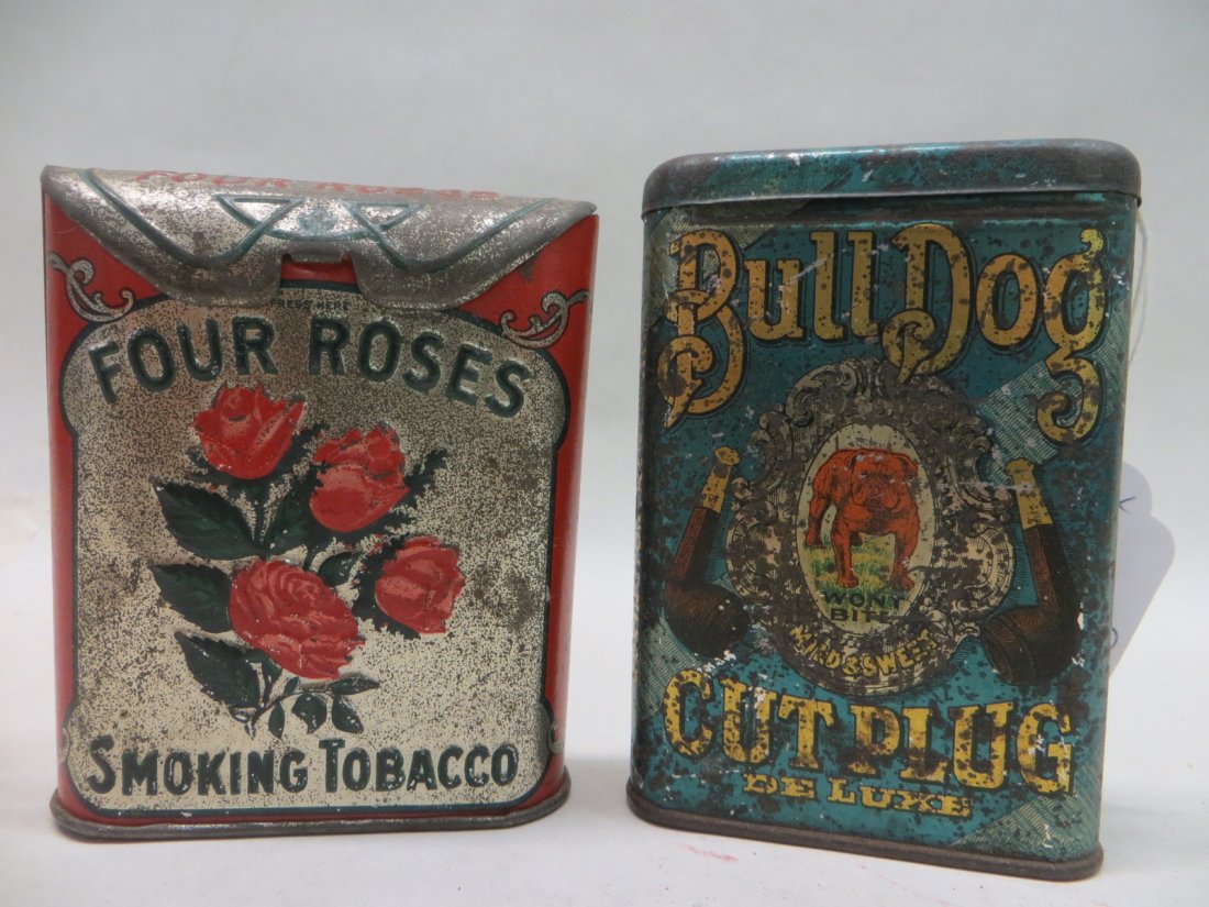 Two pocket tobacco tins including Bull Dog - 4.25"H x 3: Two pocket tobacco tins including Bull Dog - 4.25"H x 3" and Four Roses with folding lock top - 4"H x 3.25". Provenance: From the Faulkner estate, New Kingston, NY.