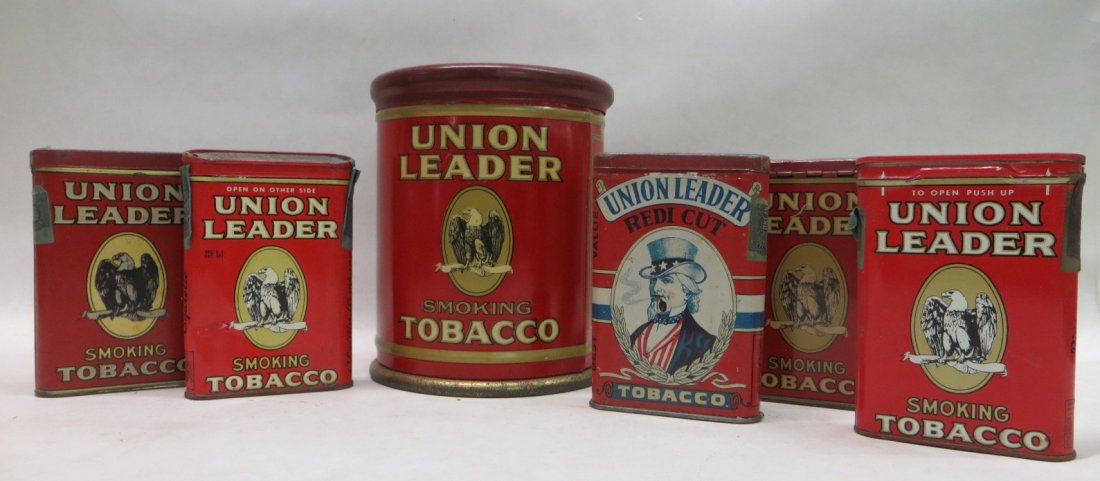 Six Union Leader tobacco tins including 5 pocket tins (: Six Union Leader tobacco tins including 5 pocket tins (4 with eagles and 1 with Uncle Sam) - 4.5"H and a cylindrical tin with central eagle - 5.25"D x 6.5"H. Provenance: From the Faulkner estate, New 
