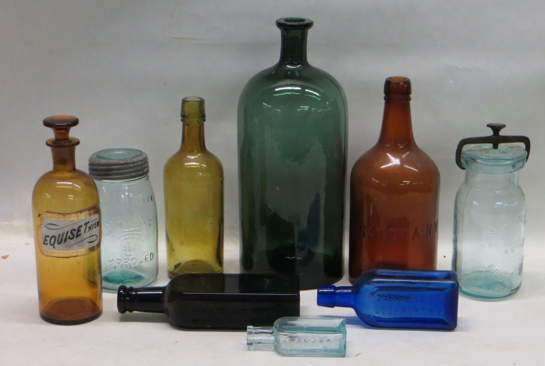 Lot of 9 old bottles including green apothecary bottle : Lot of 9 old bottles including green apothecary bottle with pontil mark on base (chip on base), Amber hand blown apothecary, Whitall's preserve jar with iron clamp lid 1861, Shaker medicine bottle fro