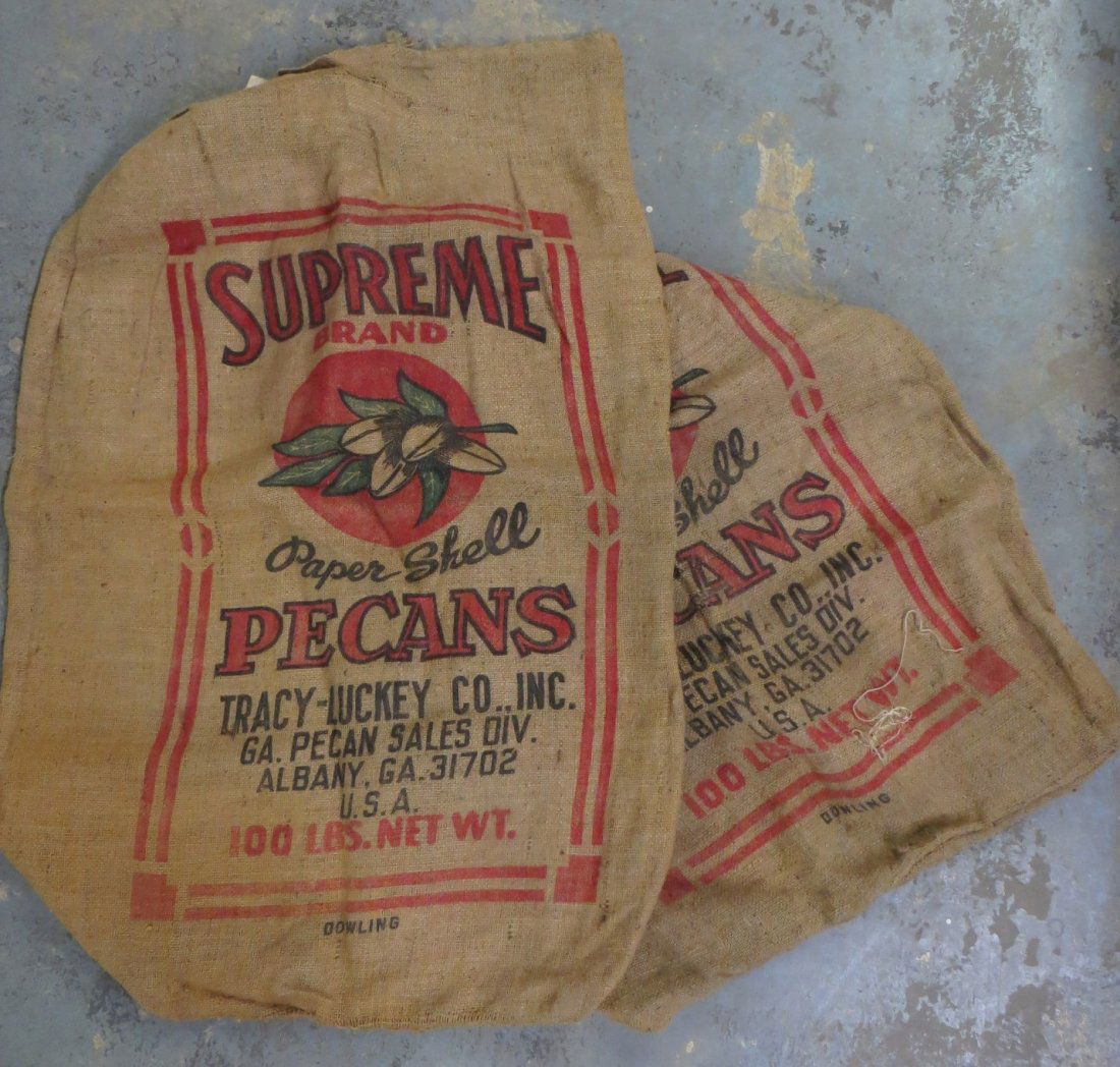 Two large burlap bags advertising Supreme Pecans, Alban: Two large burlap bags advertising Supreme Pecans, Albany Georgia.