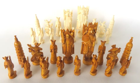 A very fine Chinese carved bone chess set, complete with 32 pieces.