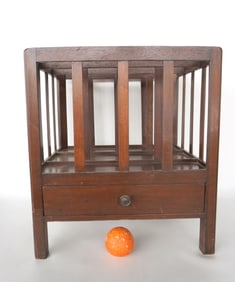 A Chippendale Canterbury with beading on square stiles and having a lower hand-dovetailed drawer -