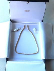 A Fortunoff 14k gold necklace marked "14k Made in Italy" in original Fortunoff leather and silk