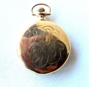 A Waltham 14k open face pocket watch. Marked on works "Waltham 15 Jewels U.S.A.". Marked on interior