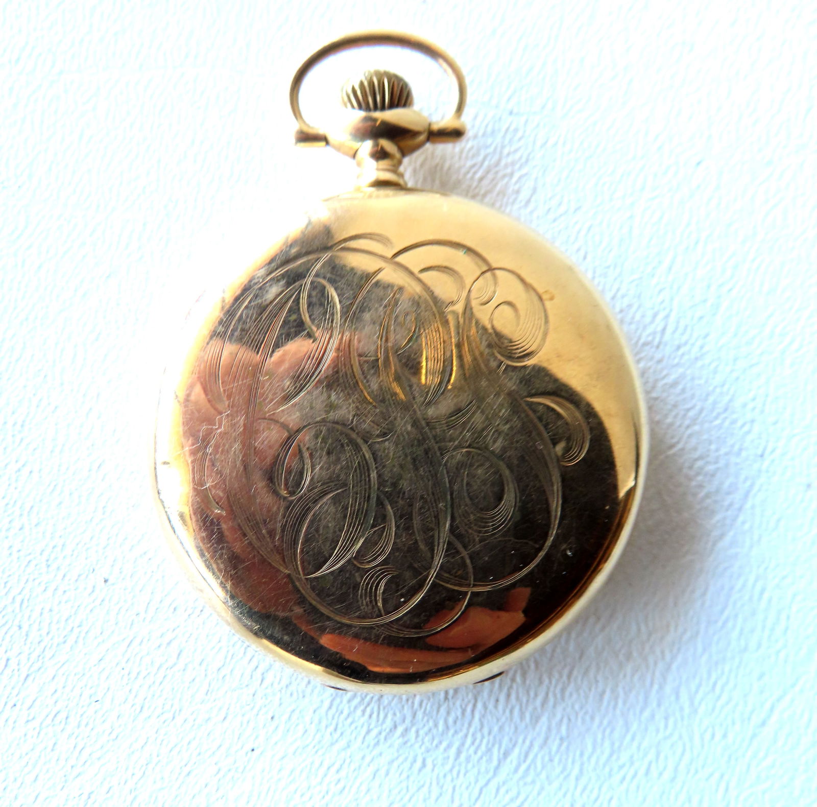 A Waltham 14k open face pocket watch. Marked on works "Waltham 15 Jewels U.S.A.". Marked on interior (1 of 8)