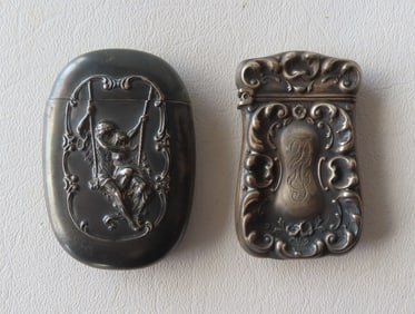 Two embossed sterling silver match safes, late 19th century, both tarnished but in good condition.