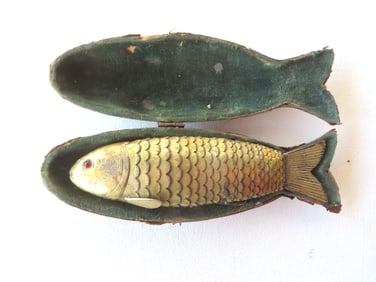 An articulated Judaica Besamim (spice/perfume box) in the shape of a fish in gold wash over silver -