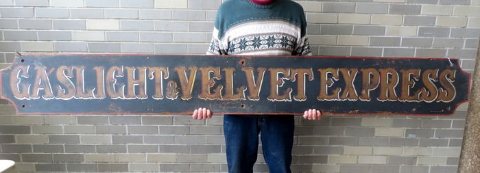 A Pete Peterson hand painted building sign marked "GASLIGHT & VELVET EXPRESS", circa 1950-60, in