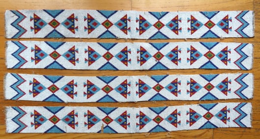 Four beaded Native American panels, each approximately 26"L x 2 3/4"W. All in good condition,