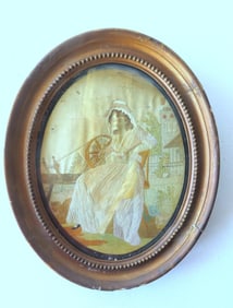 A silk embroidery of lady at spinning wheel, probably late 18th to early 19th century. Appears to be