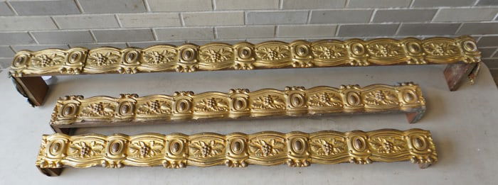 Three matching mid 19th century brass valances decorated with repeating patterns of oak leafs and