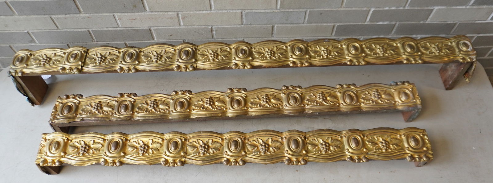 Three matching mid 19th century brass valances decorated with repeating patterns of oak leafs and (1 of 8)