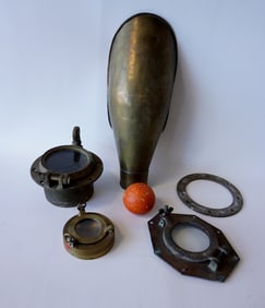 Five brass marine collectibles including a ship's air vent - this is the largest in the lot