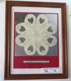 A framed 19th century Scherenschnitte (foldout scissor cut) school girl Valentine decorated with