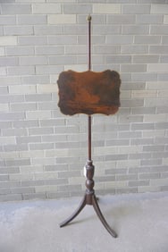 A 19th century floor standing and adjustable shield-shaped fireplace screen attached to