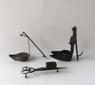 Grouping of early lighting devices including 2 Betty lamps with original hand forged iron hangers -
