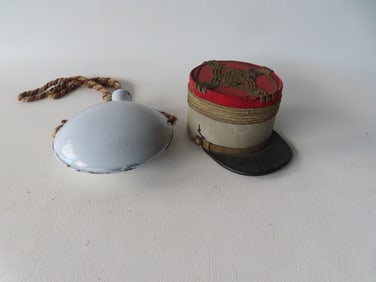 Two small military collectibles: The first a miniature French military kepi, circa 1900, either for