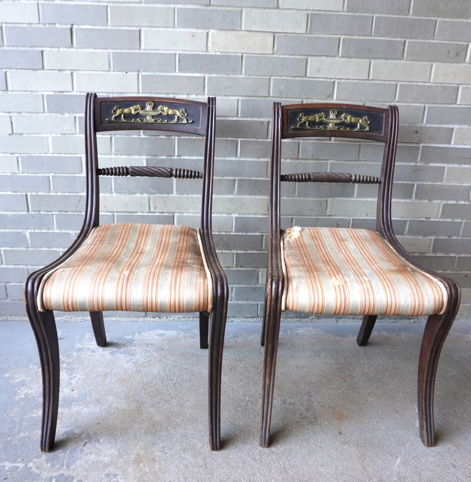 A pair of federal side chairs with reeding extending from top of stiles to terminals of feet -: A pair of federal side chairs with reeding extending from top of stiles to terminals of feet - applied bronze ormolu to back splat, circa 1820. Seats in disrepair, 3 of the 4 scrolled knobs at the top