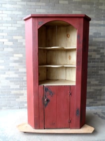 A custom made country pine corner cupboard  with lollipop shelves having an open front over 1 door,