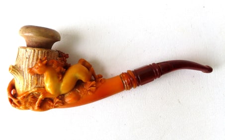 A carved Meerschaum pipe, depicting a horse racing around tree stump. The bowl with slight use wear