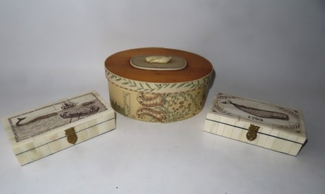 Three reproduction scrimshawed boxes including: Resin ditty box with carved whale applied to lid -