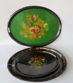 Three early toleware hand painted trays, the largest with a very large grouping of flowers in the