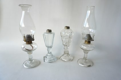 Grouping of 4 glass lighting devices including: 2 whale oil lamps, 19th century - the largest 9
