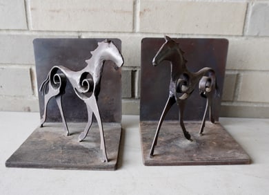 Pair of metal stylized horse bookends, hand made, probably late 20th century. Good condition.