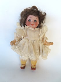 A googly eye German doll signed "Nobbi Kidd / Reg. U.S. Patent / Germany / 11/0" - spider crack on