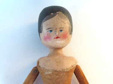 A good folk art articulated stick doll with peg joints, all hand carved in original paint, very good