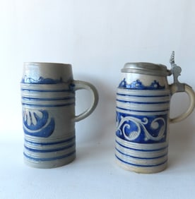 Two Westerwald stoneware tankards of cylindrical form, both probably 18th century. The first with