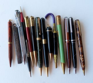 Grouping of 12 vintage lead pens by various makers, an unusual umbrella shaped extendable pencil