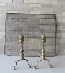 Two early hearth items including: A pair of brass Chippendale andirons in very good condition and