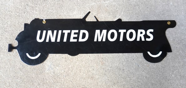 An enameled advertising sign in the shape of an open touring car, unsure of age, excellent