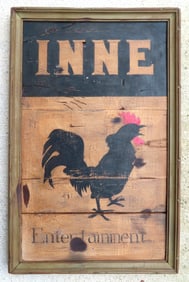 A hand made wooden sign marked "INNE ENTERTAINMENT" with image of rooster on front panel, circa