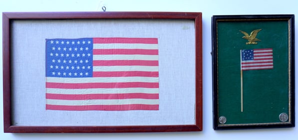 Two small framed parade flags. The first, with 45 stars and in very good condition, circa 1900 -