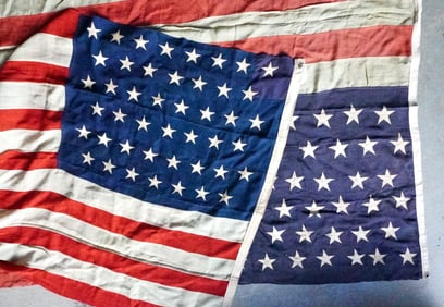 Two American 45 star flags: The first signed on header "William B. Caterson", likely the owner and