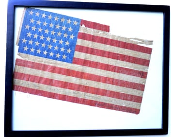 An American 45 star prohibition parade flag. It is pencil signed along the bottom white stripe that