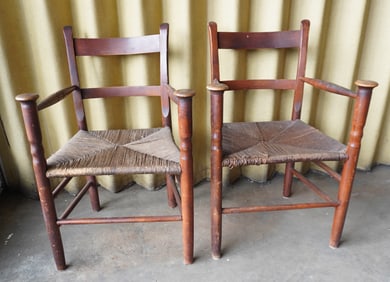 A pair of matching custom made maple arm chairs with rabbit ears and mushroom caps on top of front