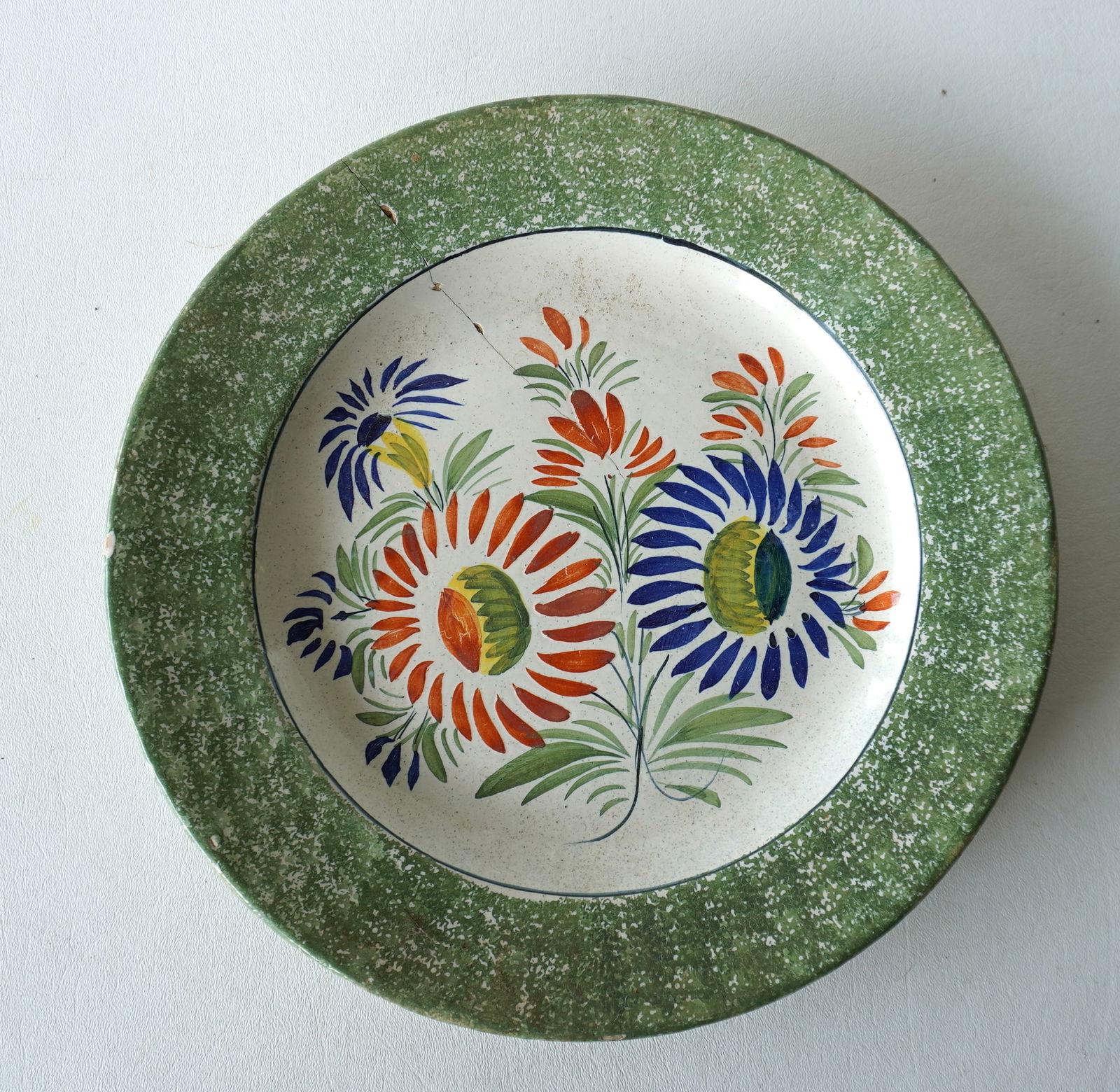 A rare spatterware hand painted tin glazed wall display plate, signed "Henriot Quimper xxx" under a (1 of 3)